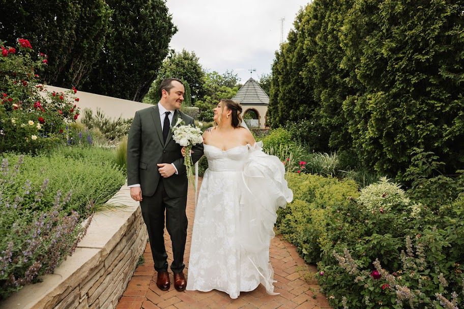 Couple walking through the gardens on their Denver wedding day
