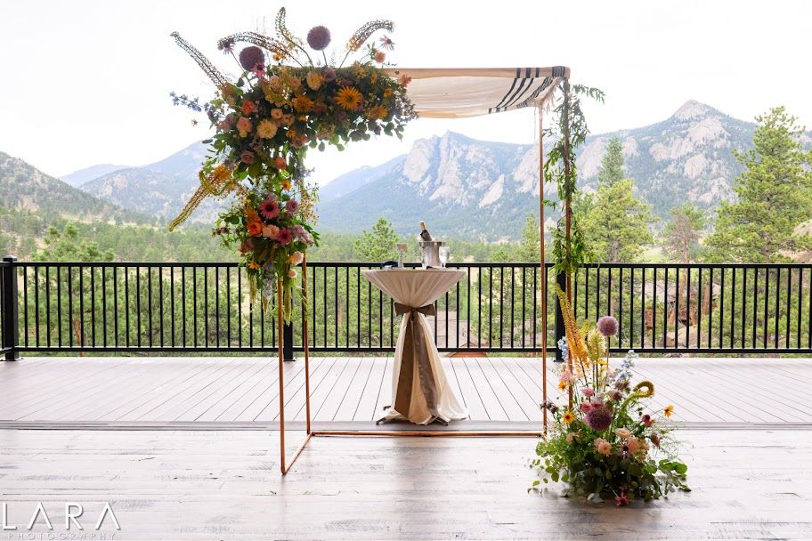 Wedding ceremony arch with Rocky Mountain views